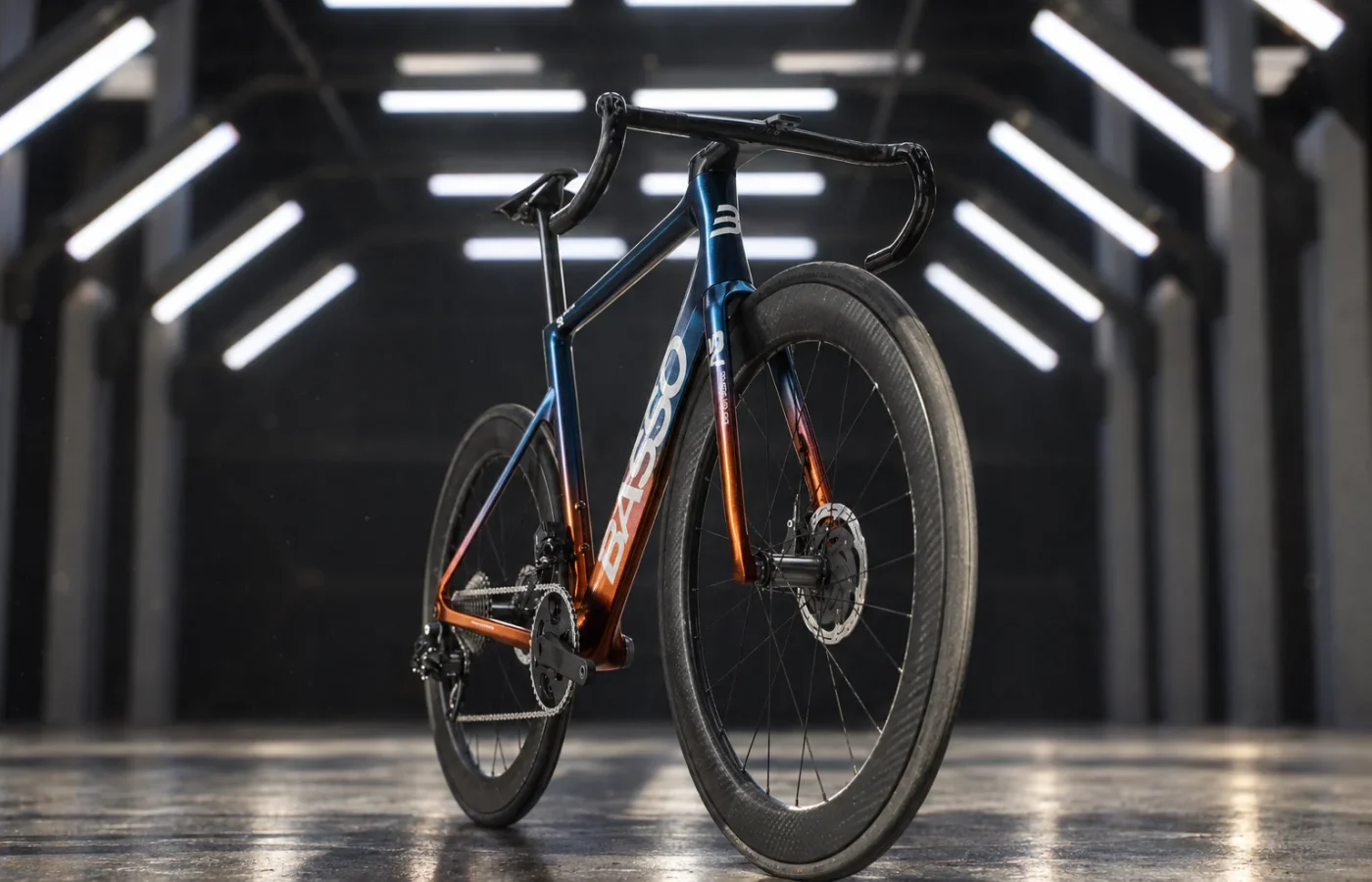 Basso SV road bike in the blue and orange livery inside an industrial warehouse
